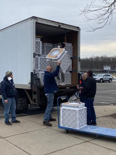 62261e4ca83f0.image people making a delivery photo