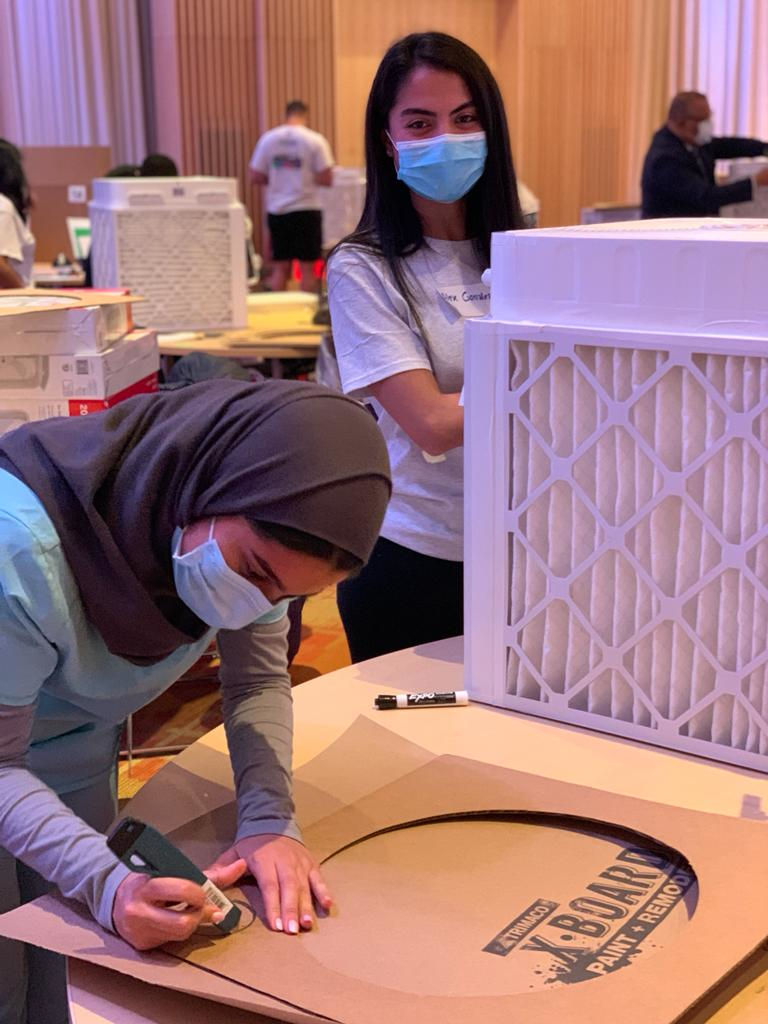 medicine-2021-12-04-1 students setting up filter with two females photo