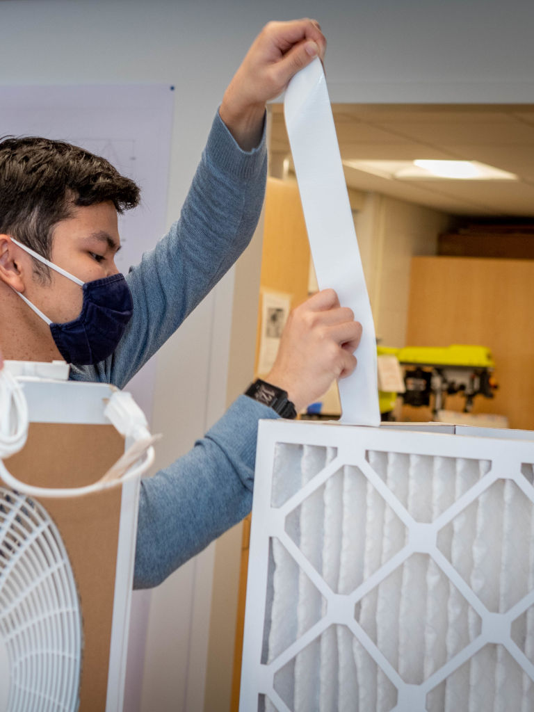 feb-2022-5 male student creating air tilter