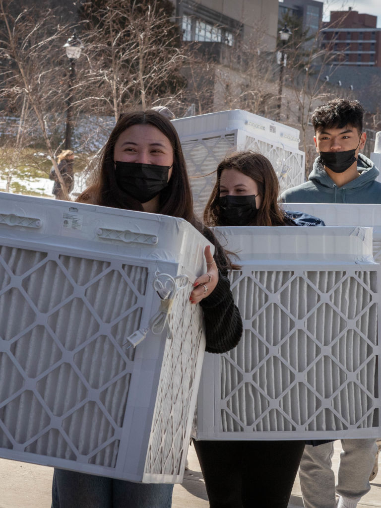 feb-2022-7 students carrying air filters
